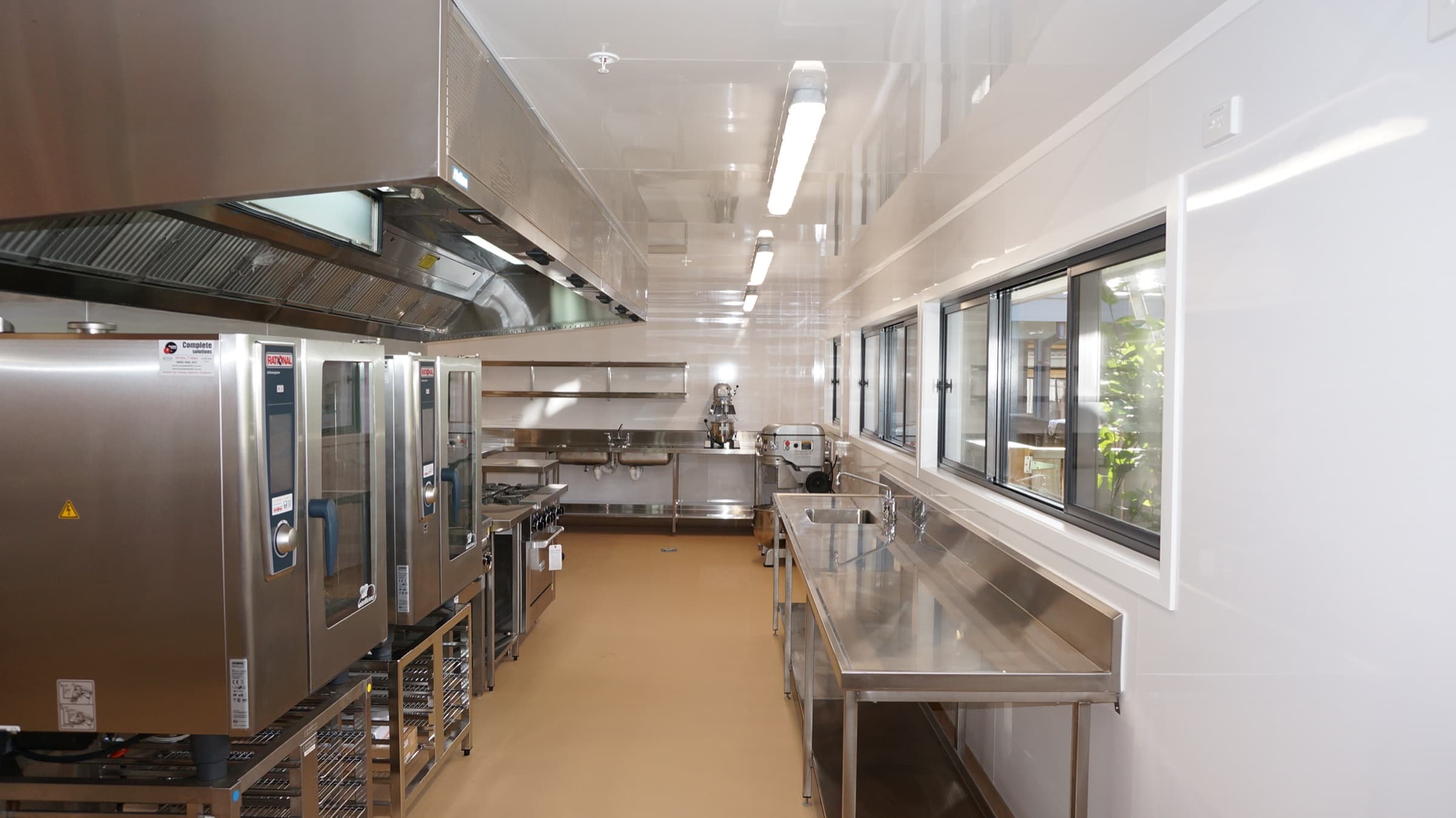 Commercial kitchen fit-out with Hydrapanel-lined walls and ceiling