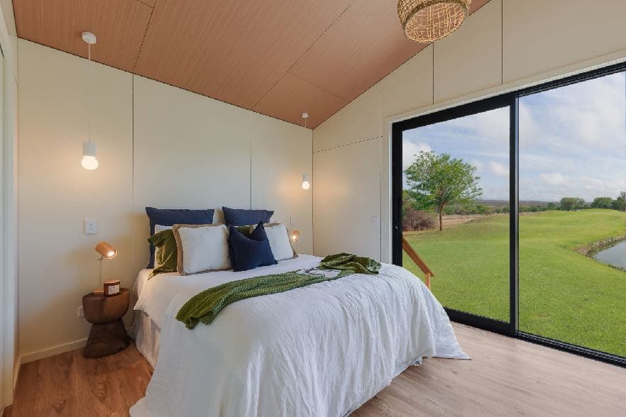 Bedroom lined with Hydrawall panels and a woodgrain decor ceiling - negative detail panel joints